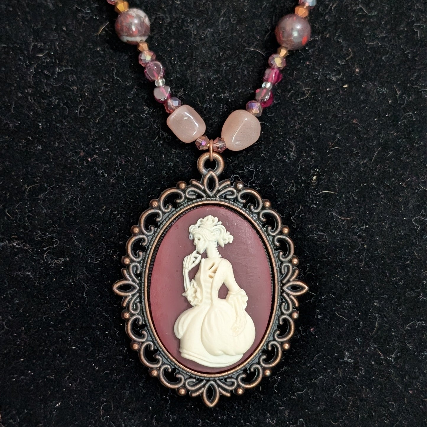 ✨Mauvelight Intrigue✨| Rhodolite Garnet, Sunstone & Tourmaline-in-Jasper Necklace With Skeletal Cameo & Floral Toggle