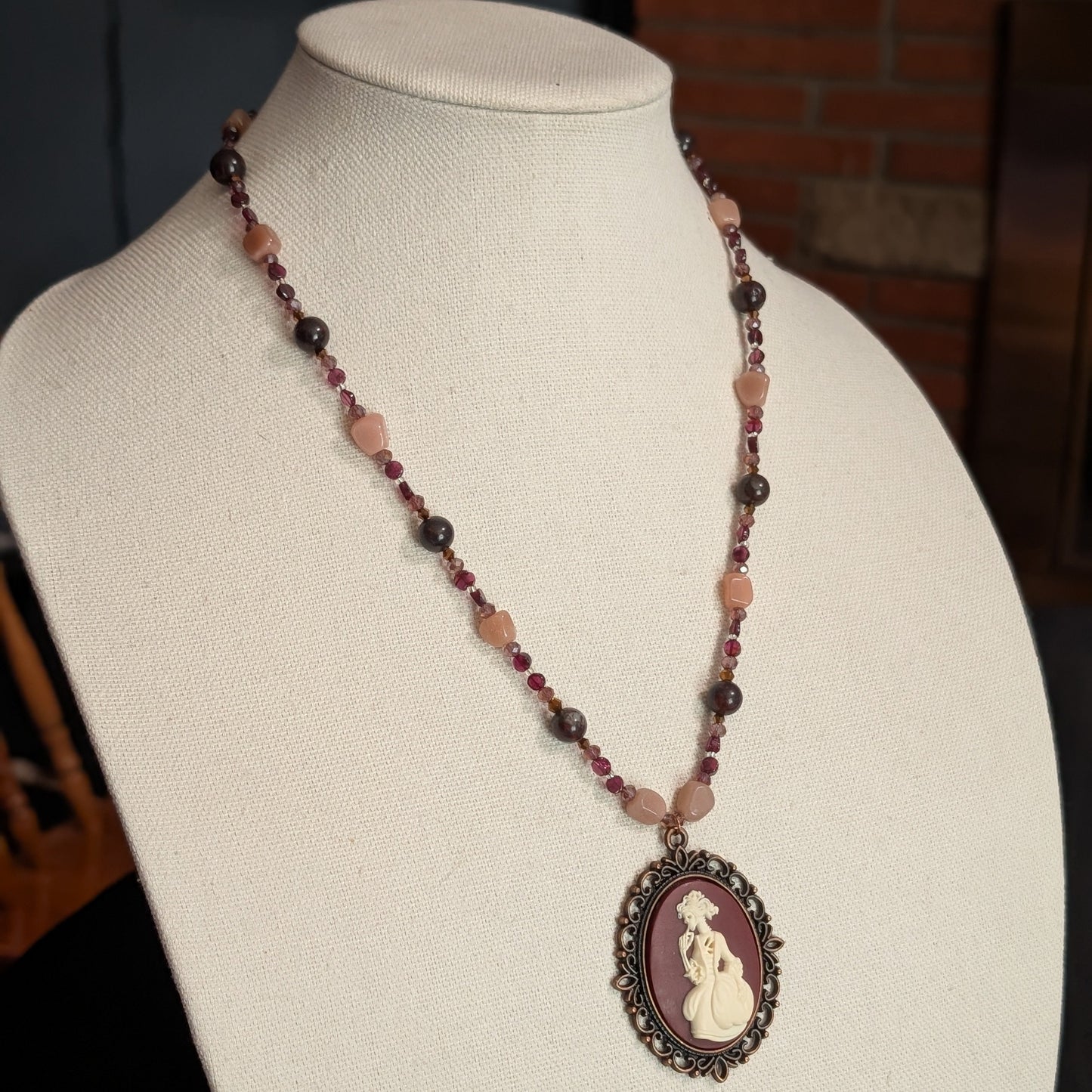 ✨Mauvelight Intrigue✨| Rhodolite Garnet, Sunstone & Tourmaline-in-Jasper Necklace With Skeletal Cameo & Floral Toggle