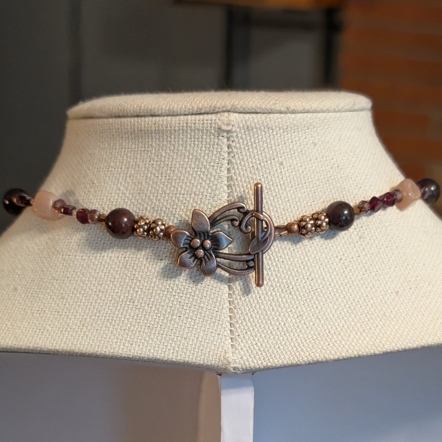 ✨Mauvelight Intrigue✨| Rhodolite Garnet, Sunstone & Tourmaline-in-Jasper Necklace With Skeletal Cameo & Floral Toggle