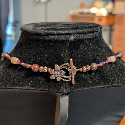 ✨Mauvelight Intrigue✨| Rhodolite Garnet, Sunstone & Tourmaline-in-Jasper Necklace With Skeletal Cameo & Floral Toggle