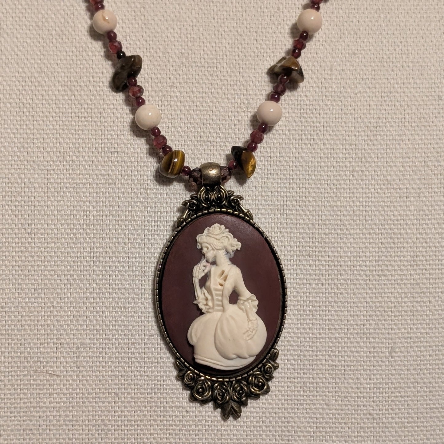 ✨Madame Foladrop✨| Garnet, Riverstone & Tiger’s Eye Skeleton Cameo Necklace