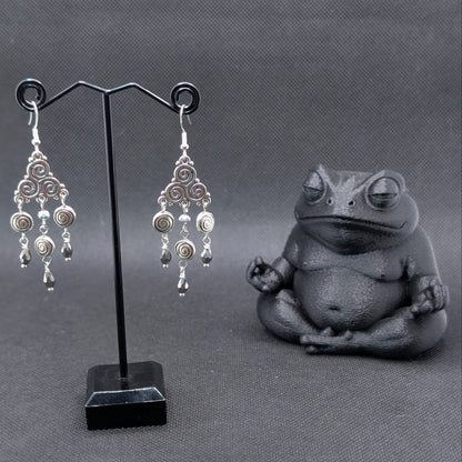 ✨Triskeligo✨ | Silver Triple Spiral Chandelier Earrings with Faceted Black Drops