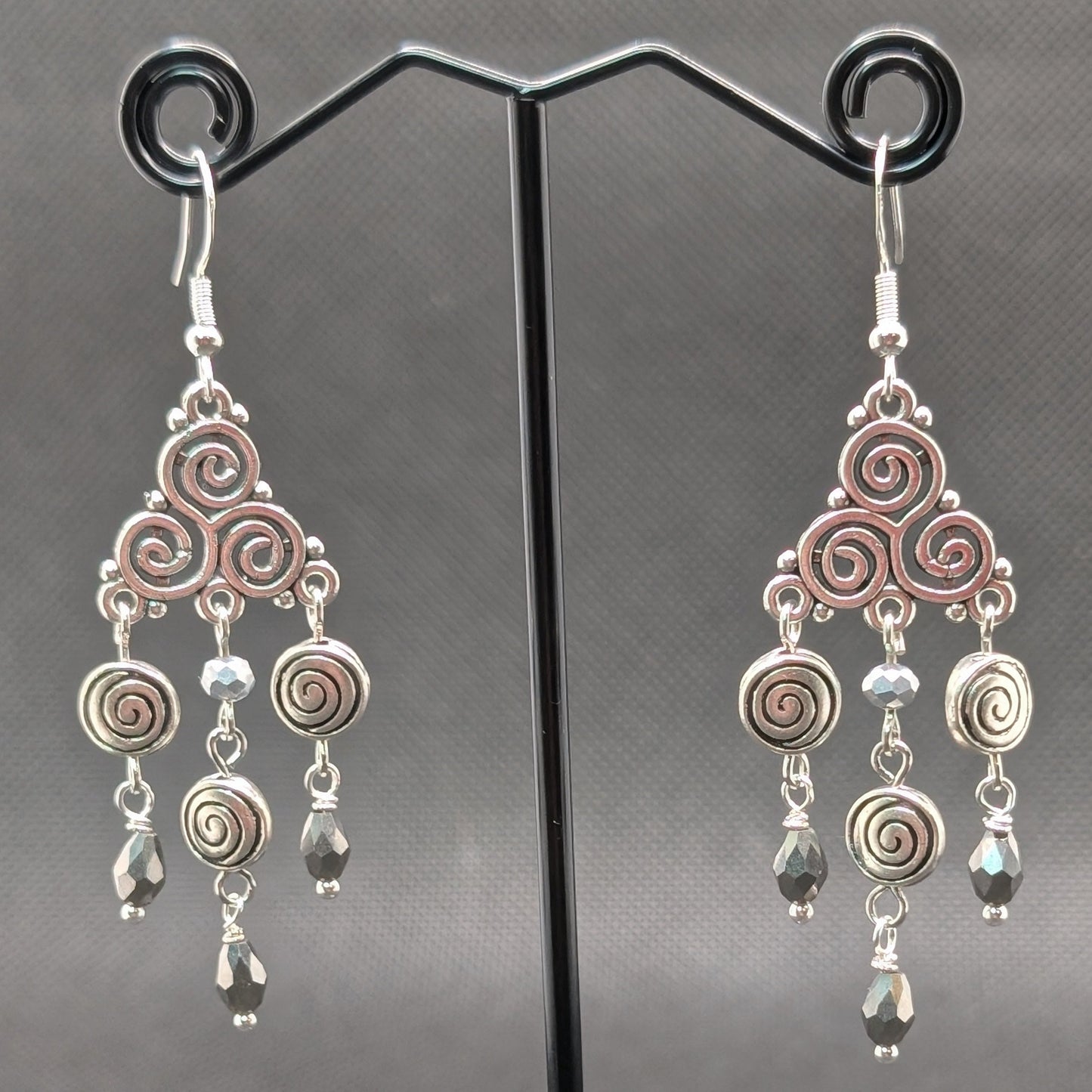 ✨Triskeligo✨ | Silver Triple Spiral Chandelier Earrings with Faceted Black Drops