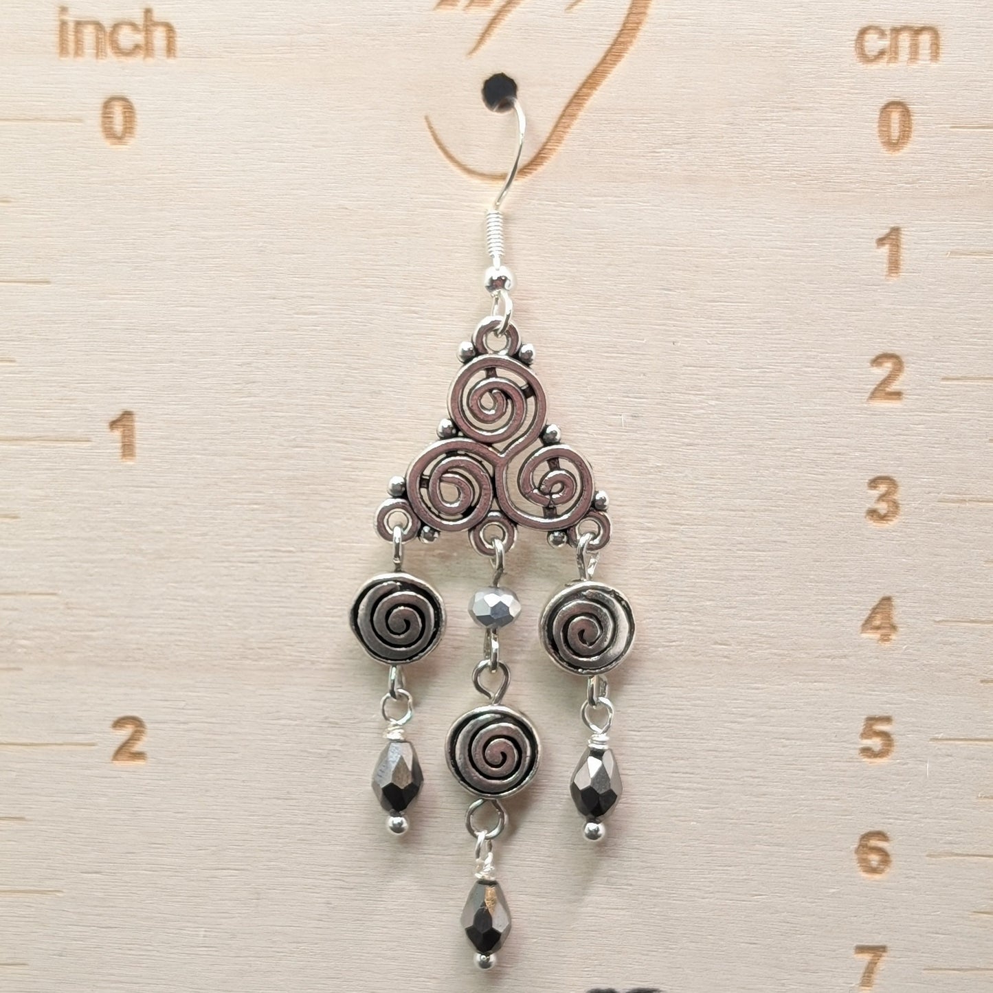 ✨Triskeligo✨ | Silver Triple Spiral Chandelier Earrings with Faceted Black Drops
