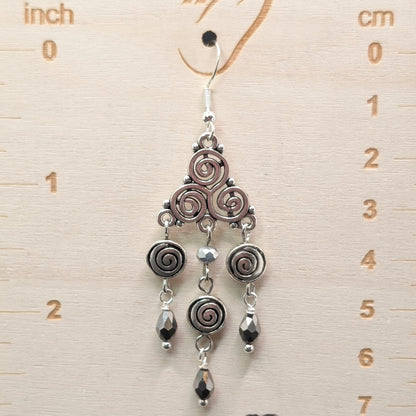 ✨Triskeligo✨ | Silver Triple Spiral Chandelier Earrings with Faceted Black Drops